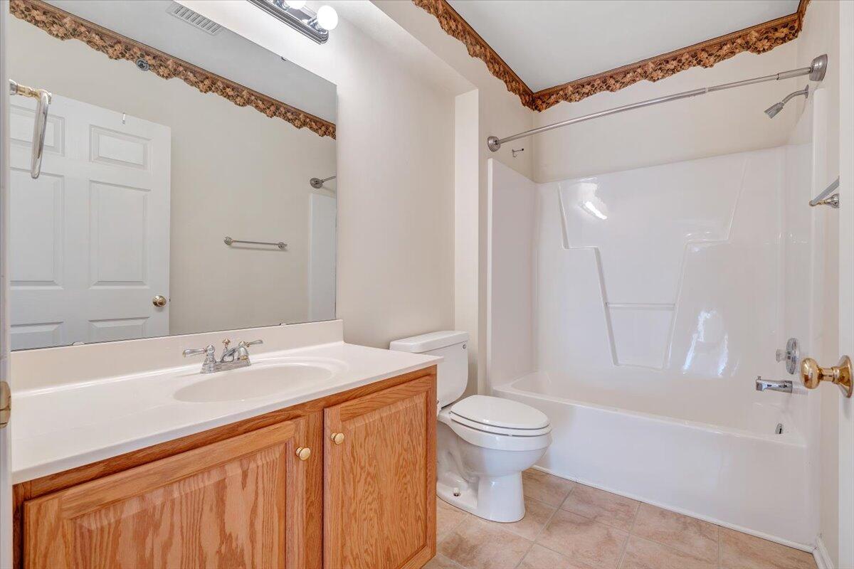 4448 Pheasant Ridge Road, Unit 307 Roanoke, VA 24014 - Photo 25 of 30 a bathroom with a sink a toilet and a bathtub