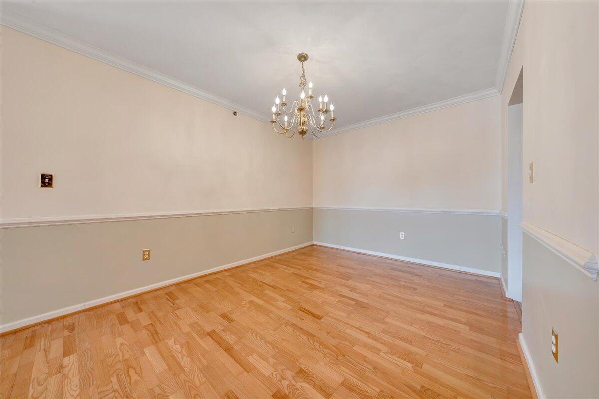 4448 Pheasant Ridge Road, Unit 307 Roanoke, VA 24014 - Photo 8 of 30 wooden floor in an empty room