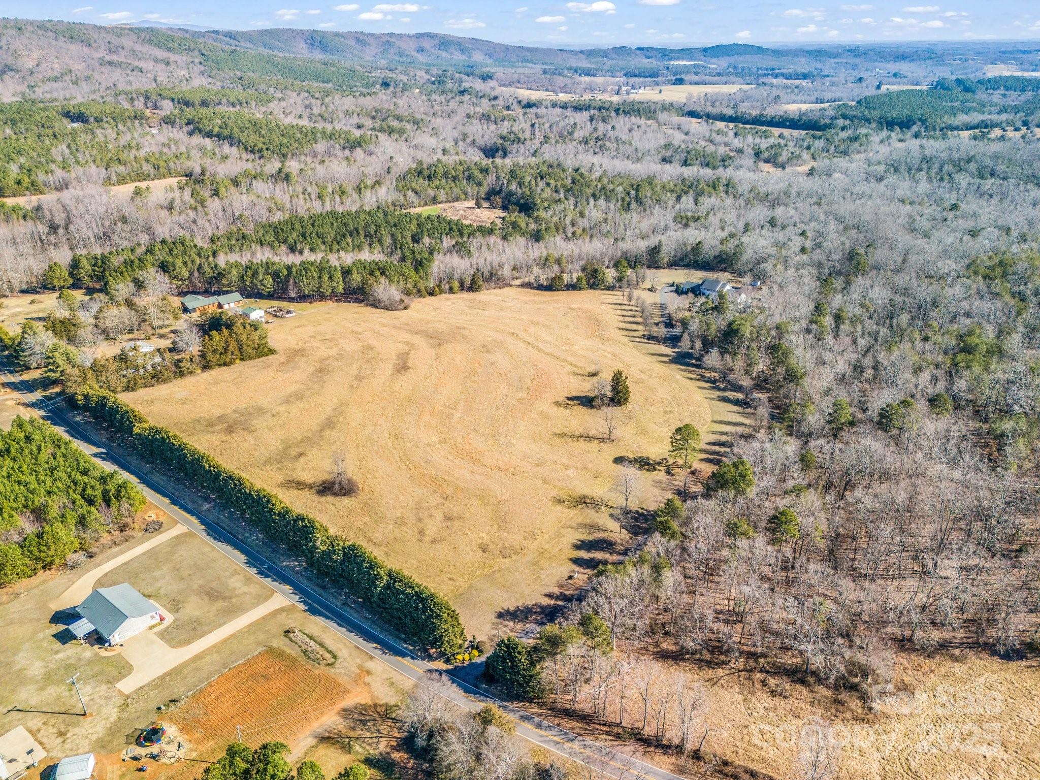 532 Harvey Logan Road Bostic, NC 28018 - Photo 17 of 48 a view of a dry yard with green space