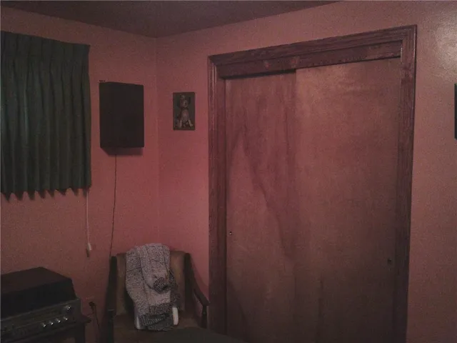 a bathroom with a shower and a toilet