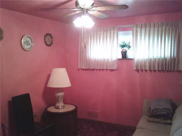 a view of hall way with furniture