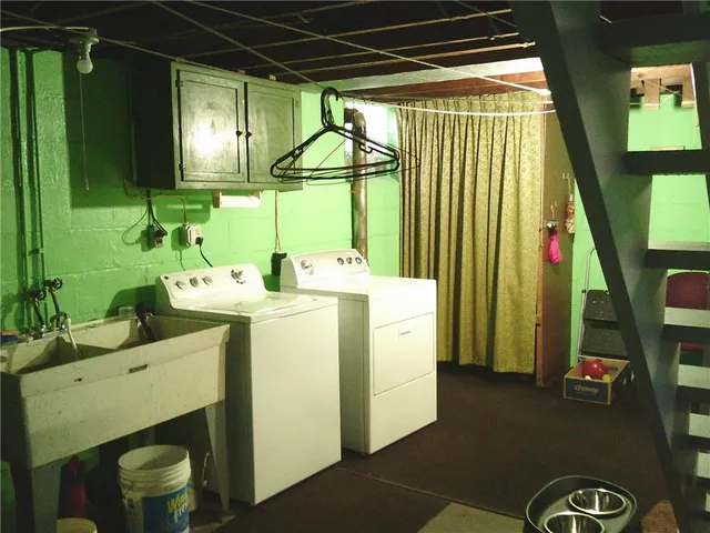 a room with sink and washing machine