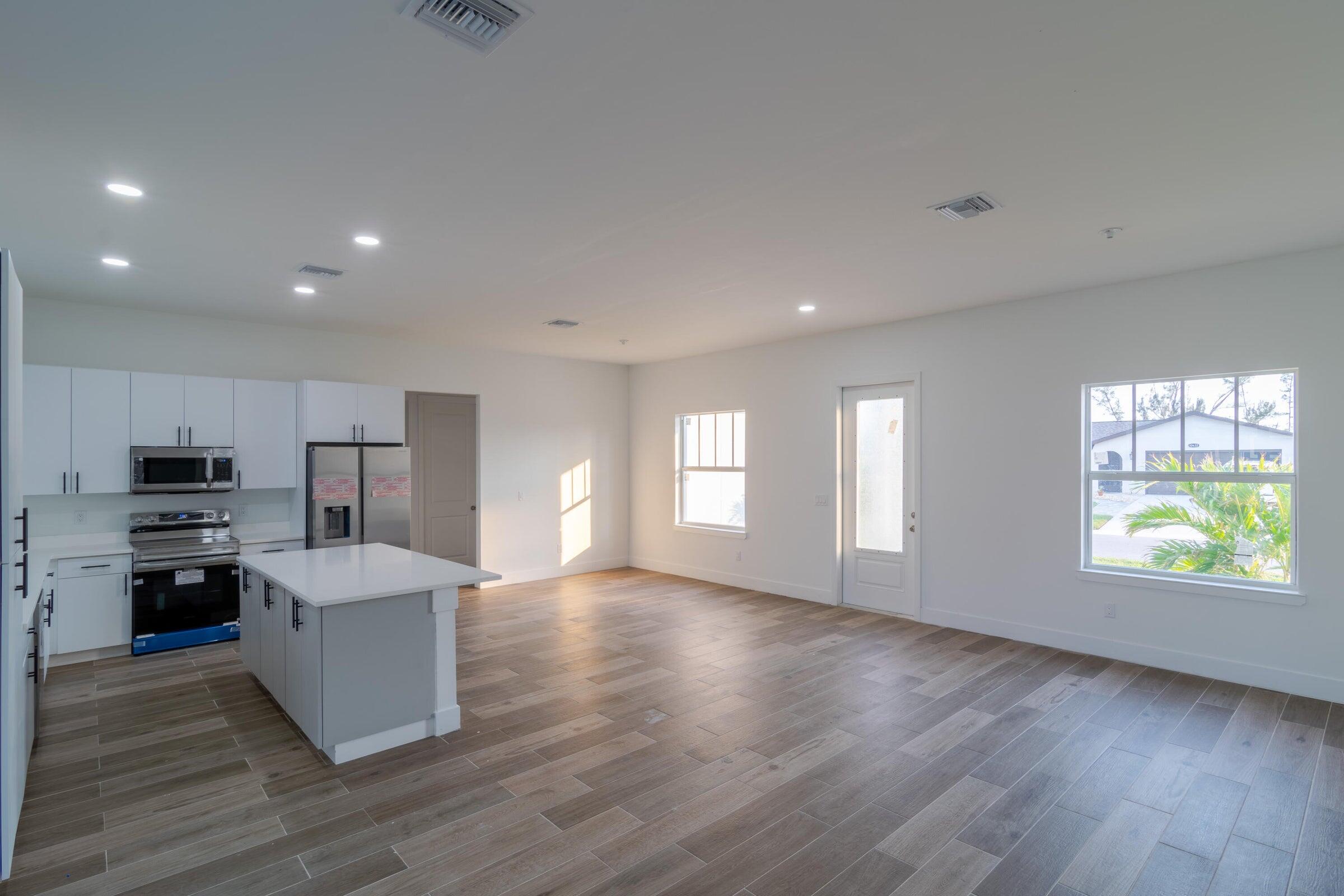 10625 Ayear Road Port Charlotte, FL 33981 - Photo 13 of 33 a view of a kitchen with microwave and stove