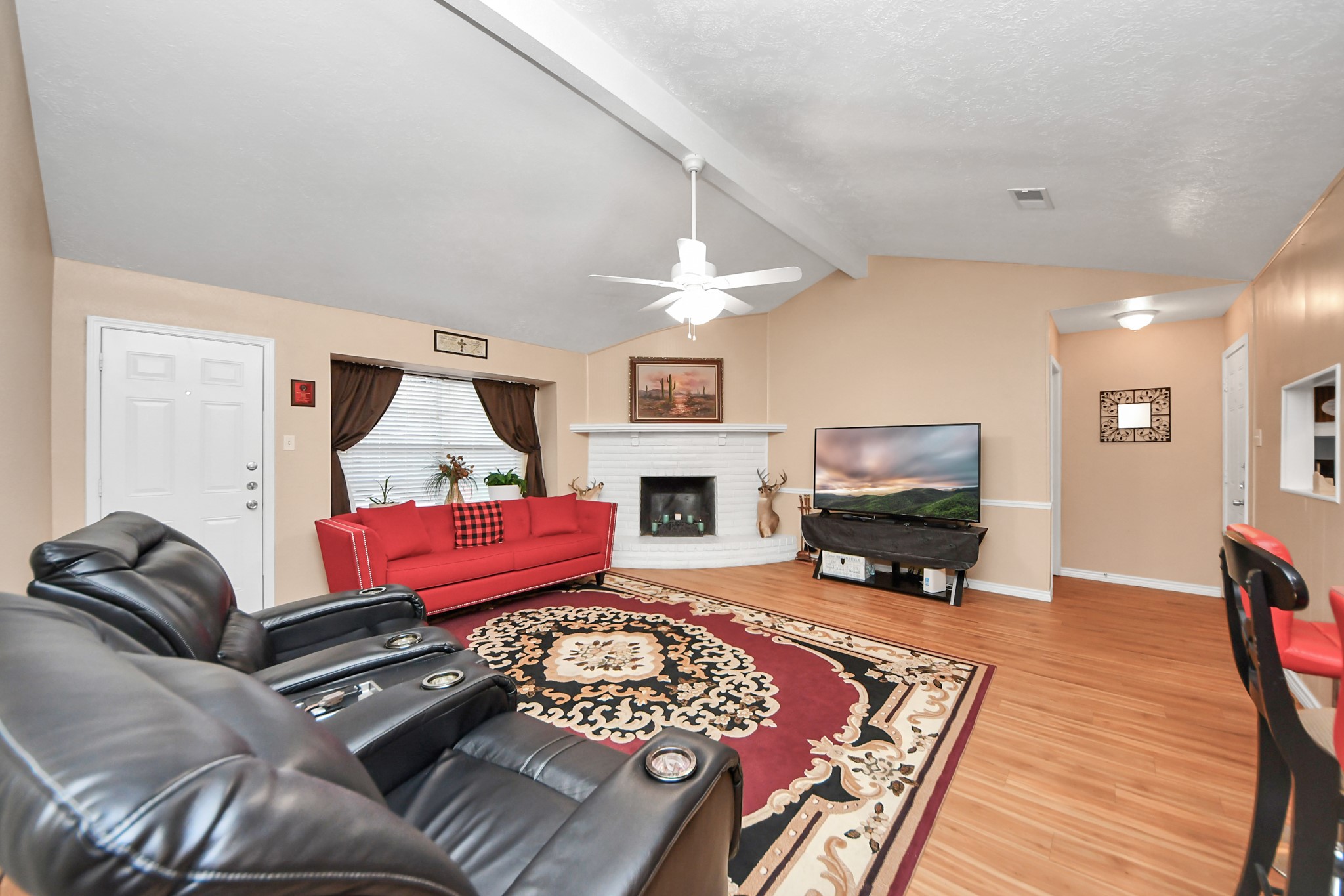 23127 Harpergate Drive Spring, TX 77373 - Photo 15 of 43 a living room with furniture and a flat screen tv