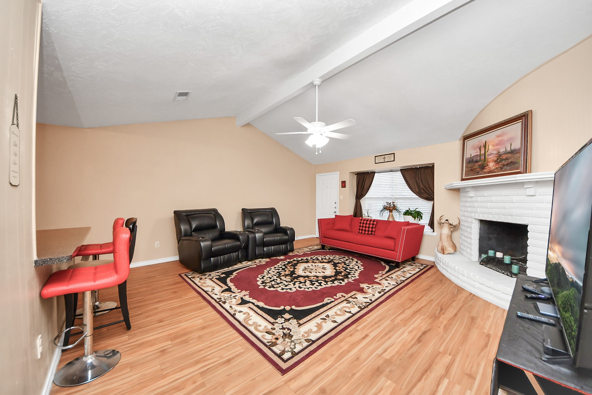 23127 Harpergate Drive Spring, TX 77373 - Photo 16 of 43 a living room with furniture and a fireplace