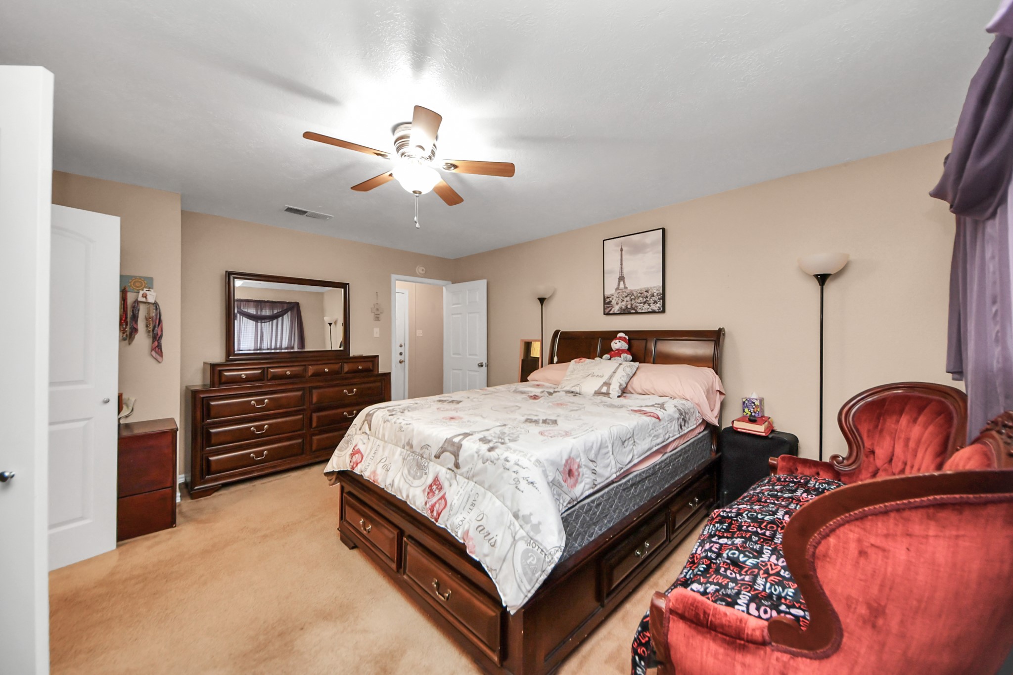 23127 Harpergate Drive Spring, TX 77373 - Photo 19 of 43 a bedroom with bed and wooden furniture