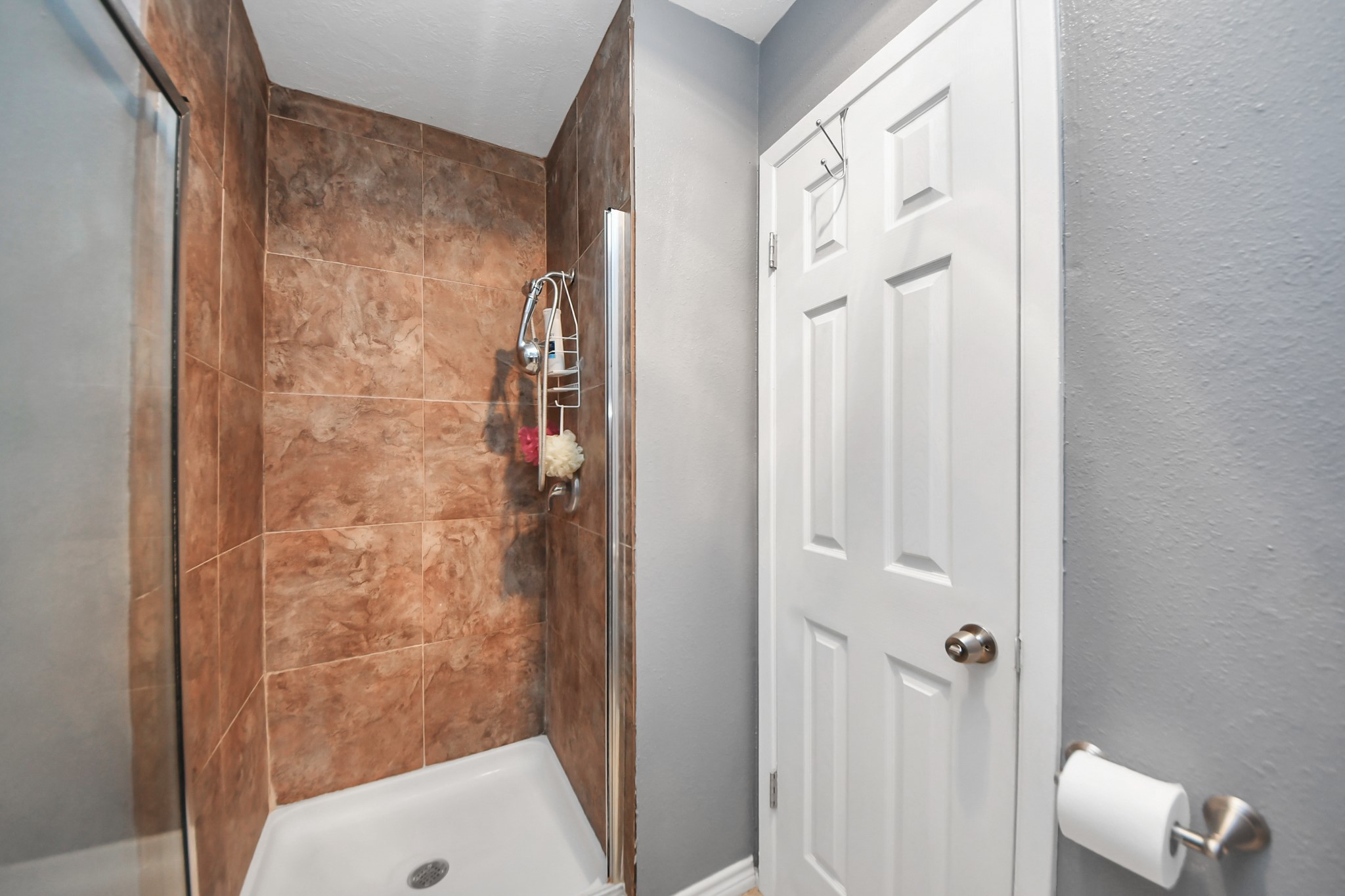 23127 Harpergate Drive Spring, TX 77373 - Photo 21 of 43 a bathroom with a shower and a sink