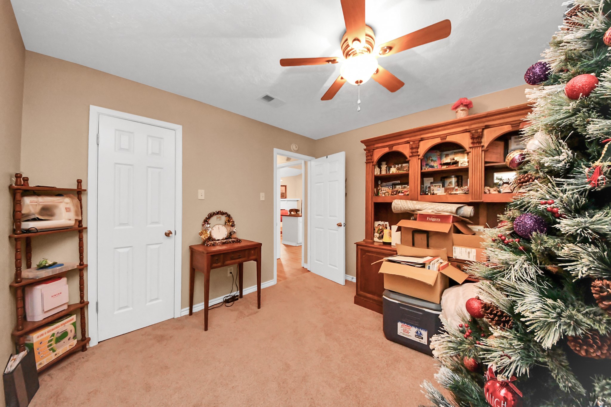 23127 Harpergate Drive Spring, TX 77373 - Photo 24 of 43 a bedroom with furniture and a book shelf