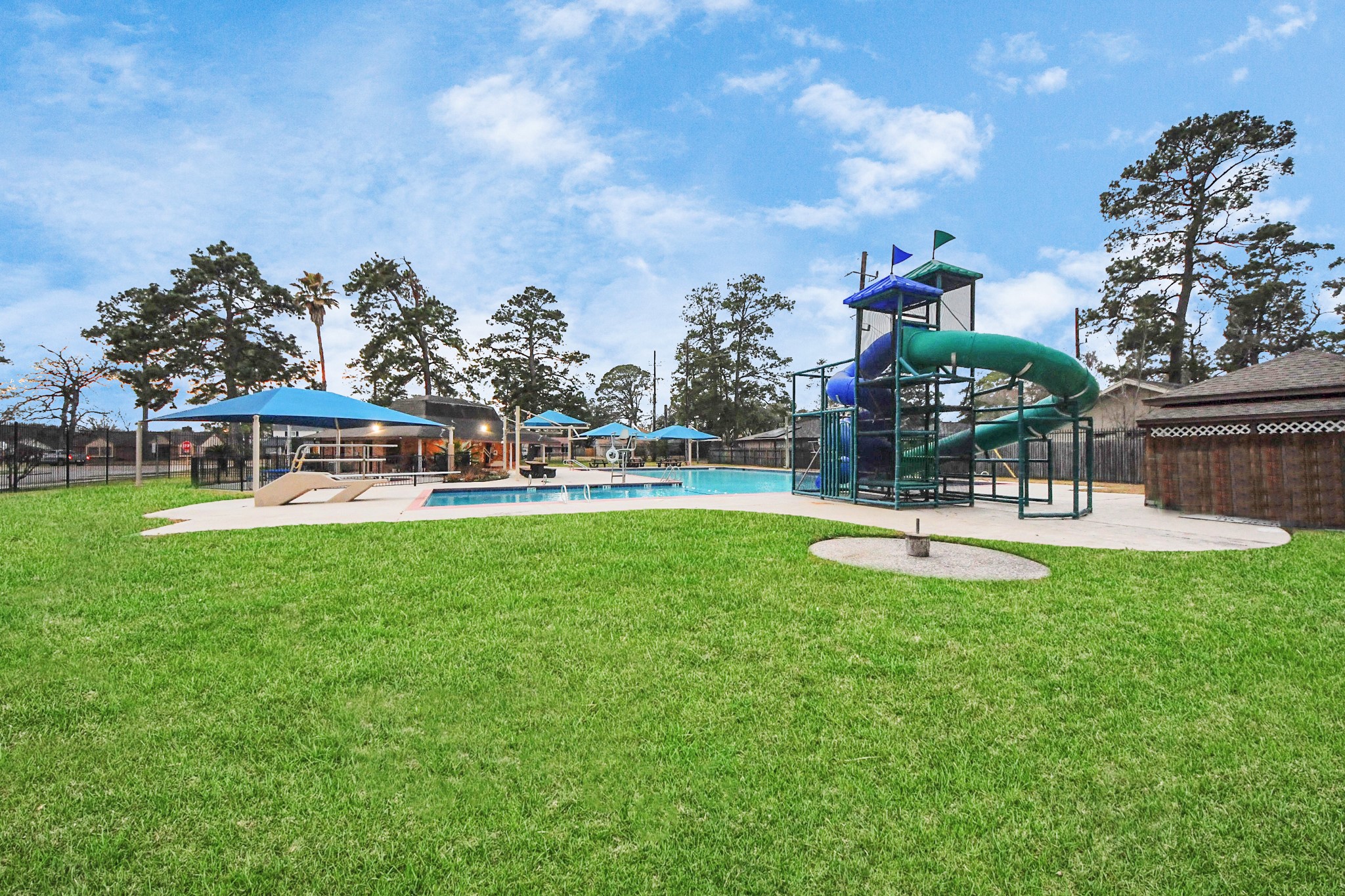 23127 Harpergate Drive Spring, TX 77373 - Photo 33 of 43 a view of a park with swings and slides