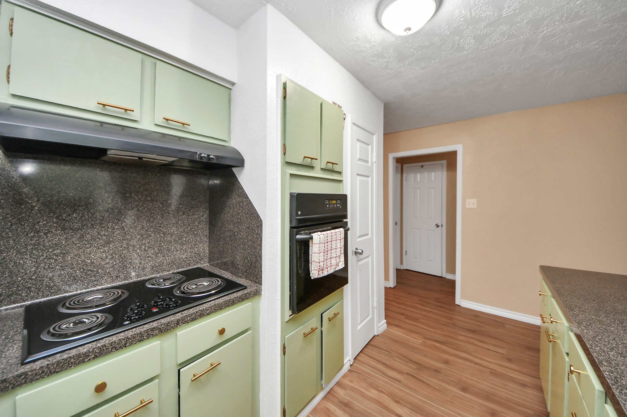 23127 Harpergate Drive Spring, TX 77373 - Photo 8 of 43 a kitchen with granite countertop a stove and a refrigerator