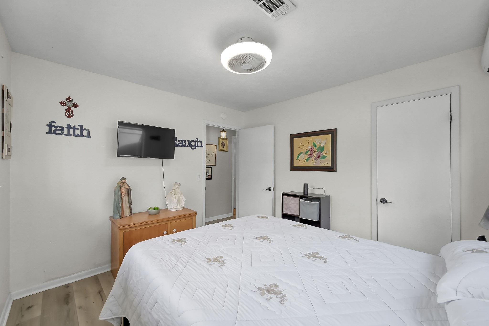 329 Sassafras Drive Trinity, TX 75862 - Photo 19 of 48 a bedroom with a bed and a flat screen tv