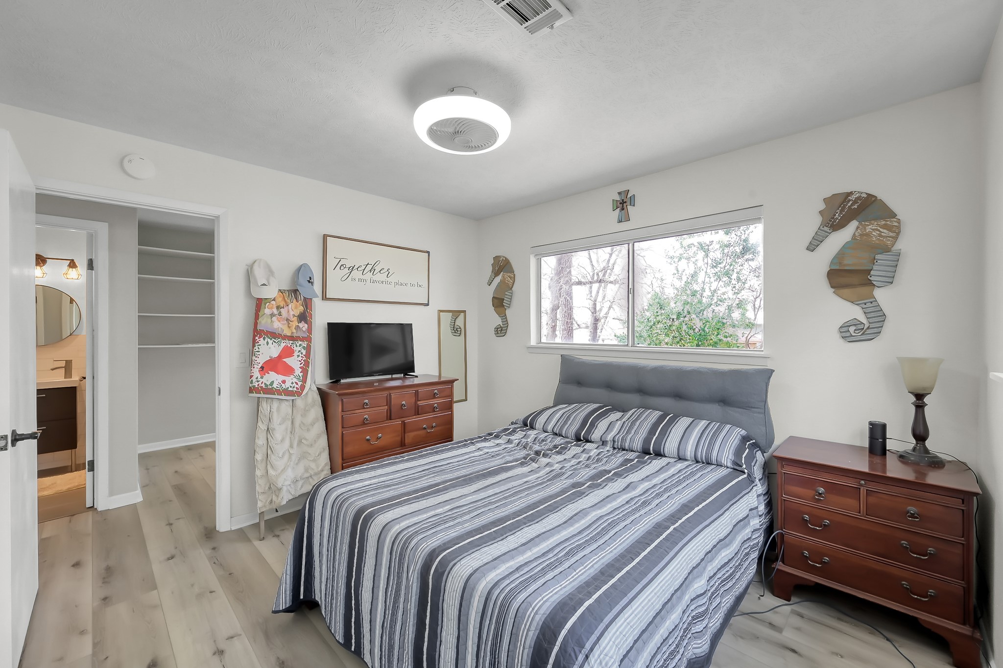 329 Sassafras Drive Trinity, TX 75862 - Photo 23 of 48 a bedroom with a large bed and a flat tv screen
