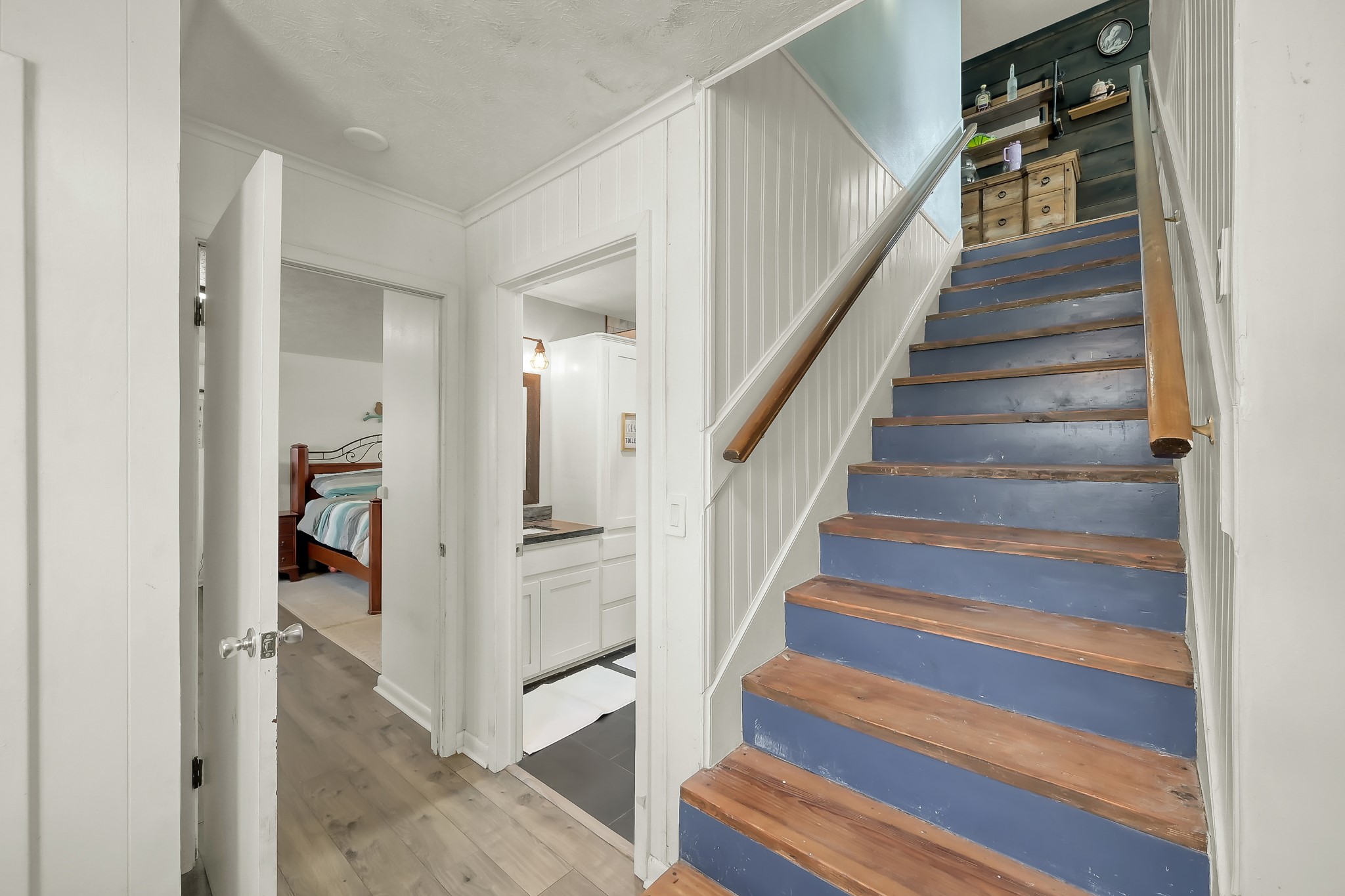 329 Sassafras Drive Trinity, TX 75862 - Photo 27 of 48 a view of staircase with white walls and a chandelier