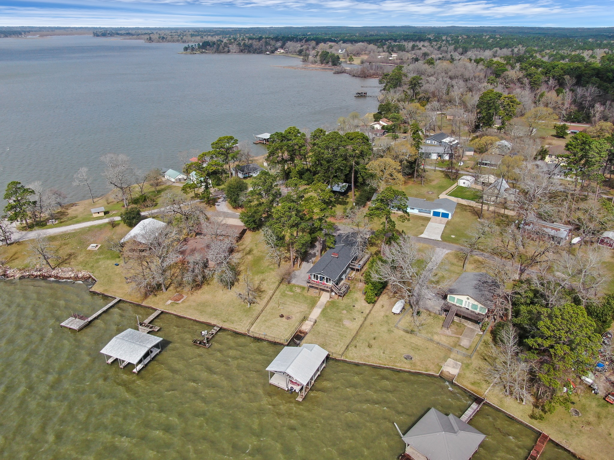 329 Sassafras Drive Trinity, TX 75862 - Photo 46 of 48 an aerial view of a house with a yard and lake view