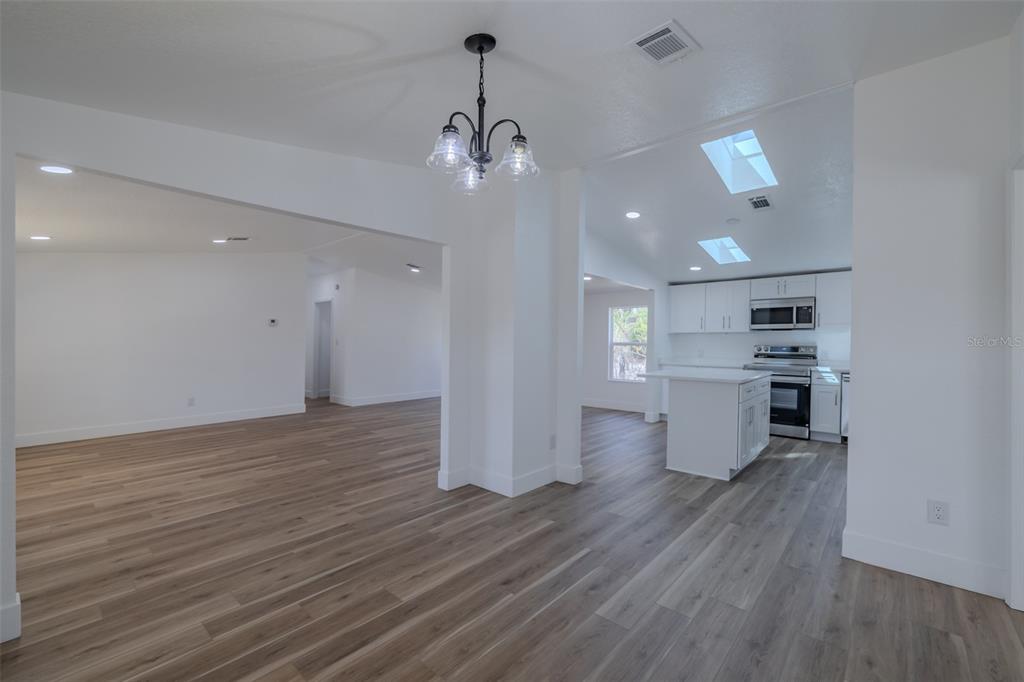 8301 Henry George Road Plant City, FL 33567 - Photo 17 of 51 a view of a kitchen and wooden floor
