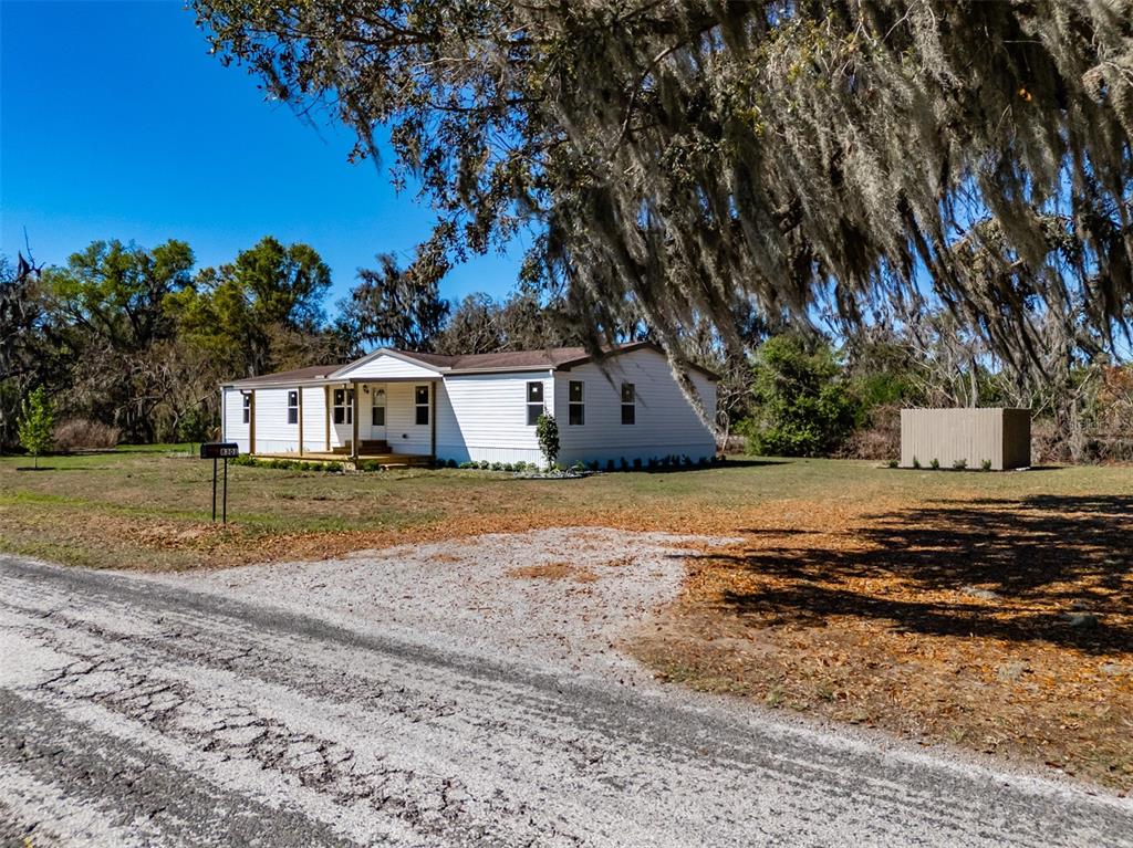 8301 Henry George Road Plant City, FL 33567 - Photo 2 of 51 a house view with a outdoor space