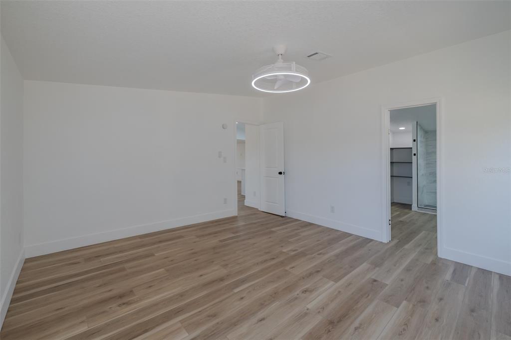 8301 Henry George Road Plant City, FL 33567 - Photo 21 of 51 a view of a room with wooden floor and a sink