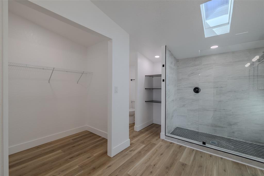 8301 Henry George Road Plant City, FL 33567 - Photo 24 of 51 a bathroom with a glass shower door