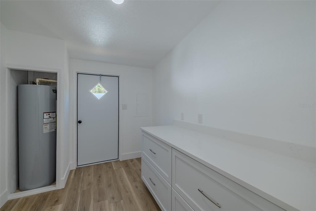 8301 Henry George Road Plant City, FL 33567 - Photo 27 of 51 an empty room with wooden floor