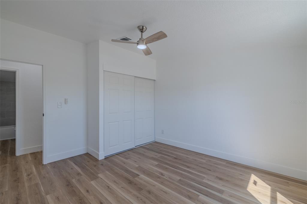8301 Henry George Road Plant City, FL 33567 - Photo 29 of 51 a view of an empty room with wooden floor
