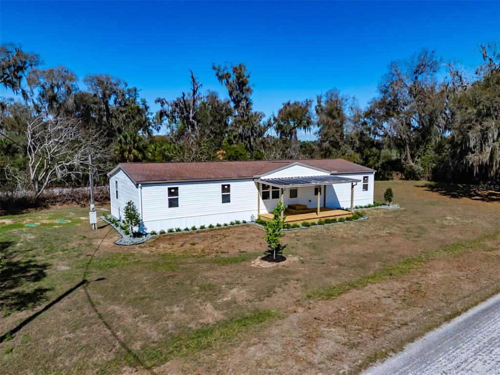 8301 Henry George Road Plant City, FL 33567 - Photo 40 of 51 a house view with a garden space