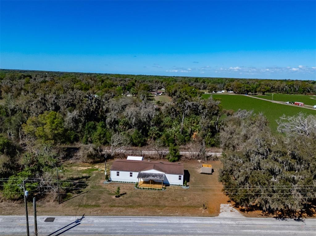 8301 Henry George Road Plant City, FL 33567 - Photo 42 of 51 a view of a lake with outdoor space