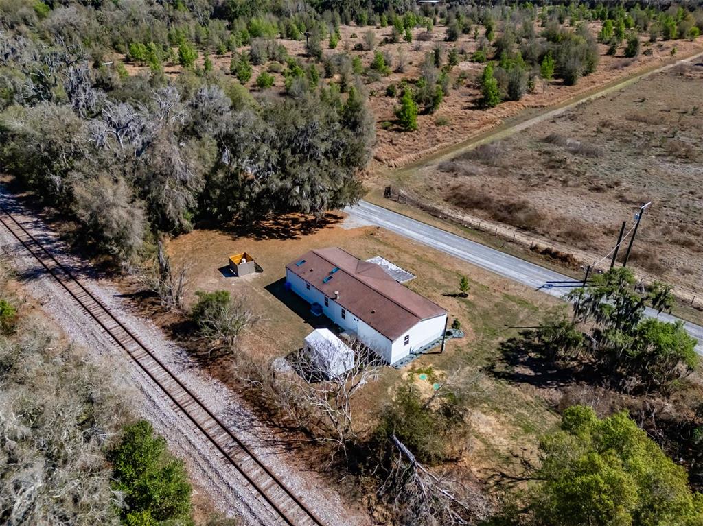 8301 Henry George Road Plant City, FL 33567 - Photo 45 of 51 a view of a house with a yard