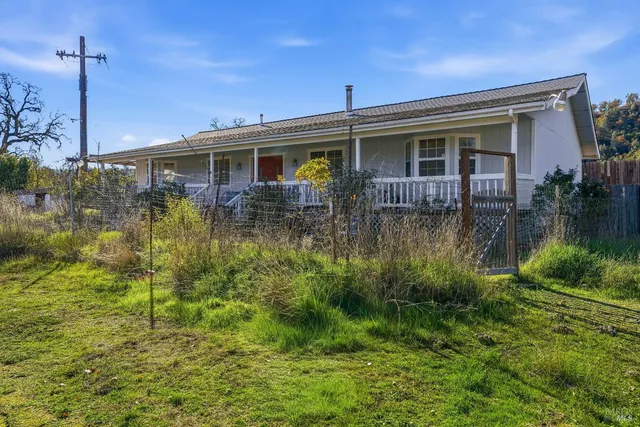 a view of a town with trees in the background
