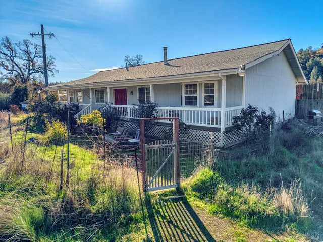 a view of backyard with green space