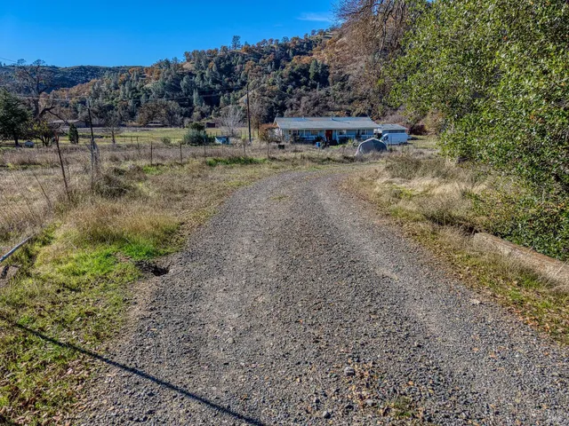 a view of a yard with a mountain