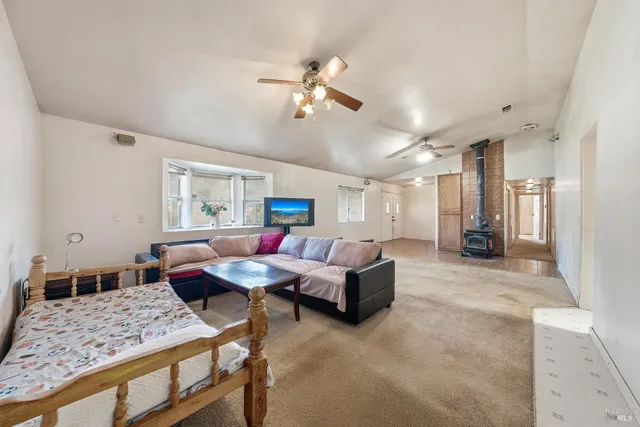 a kitchen with stainless steel appliances a stove a sink and a microwave