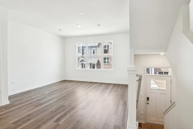 a view of livingroom with hardwood and hallway
