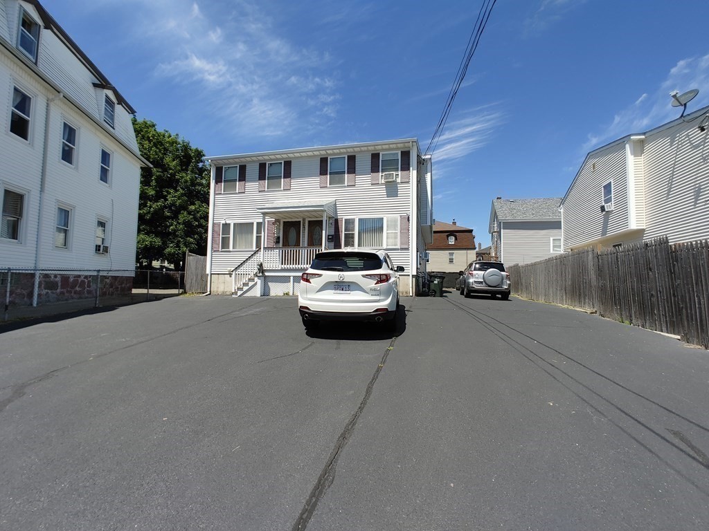 389 4th Street Fall River, MA 02721 - Photo 1 of 30 a car parked in front of a house