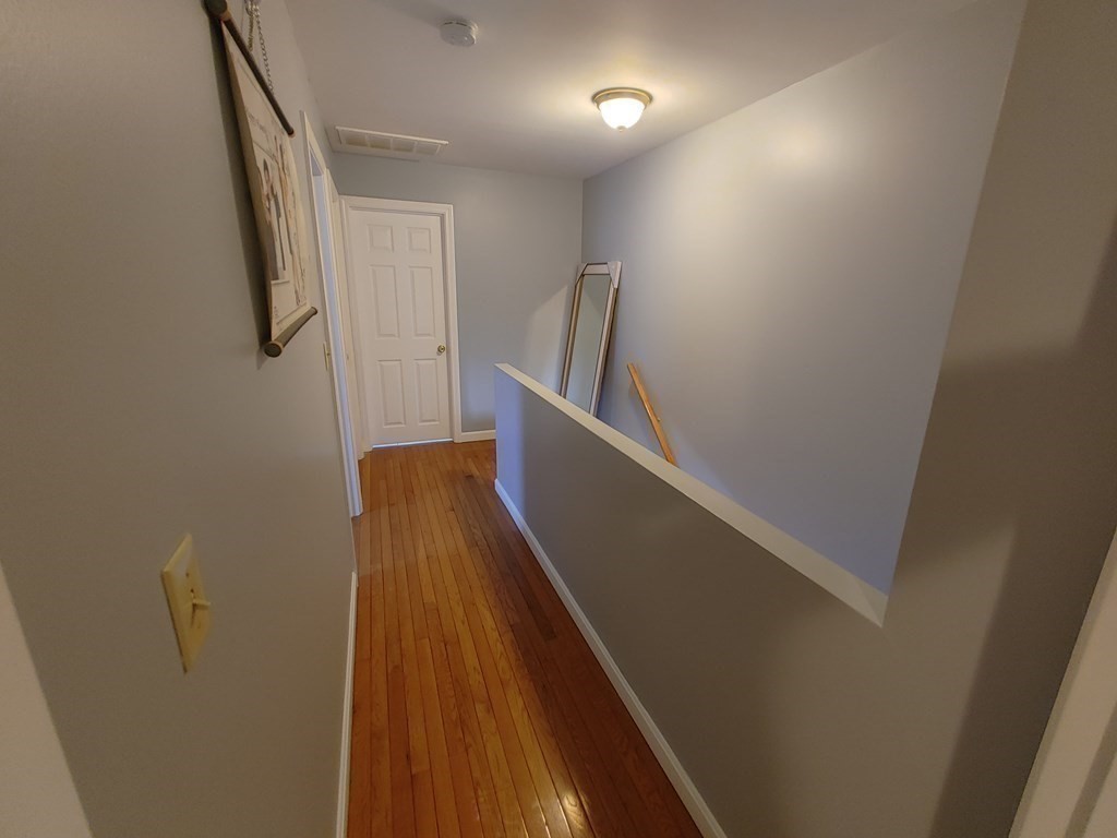 389 4th Street Fall River, MA 02721 - Photo 16 of 30 a view of entryway with wooden floor