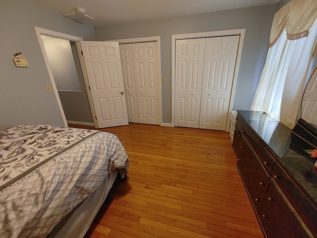 389 4th Street Fall River, MA 02721 - Photo 17 of 30 a bedroom with a bed and a mirror