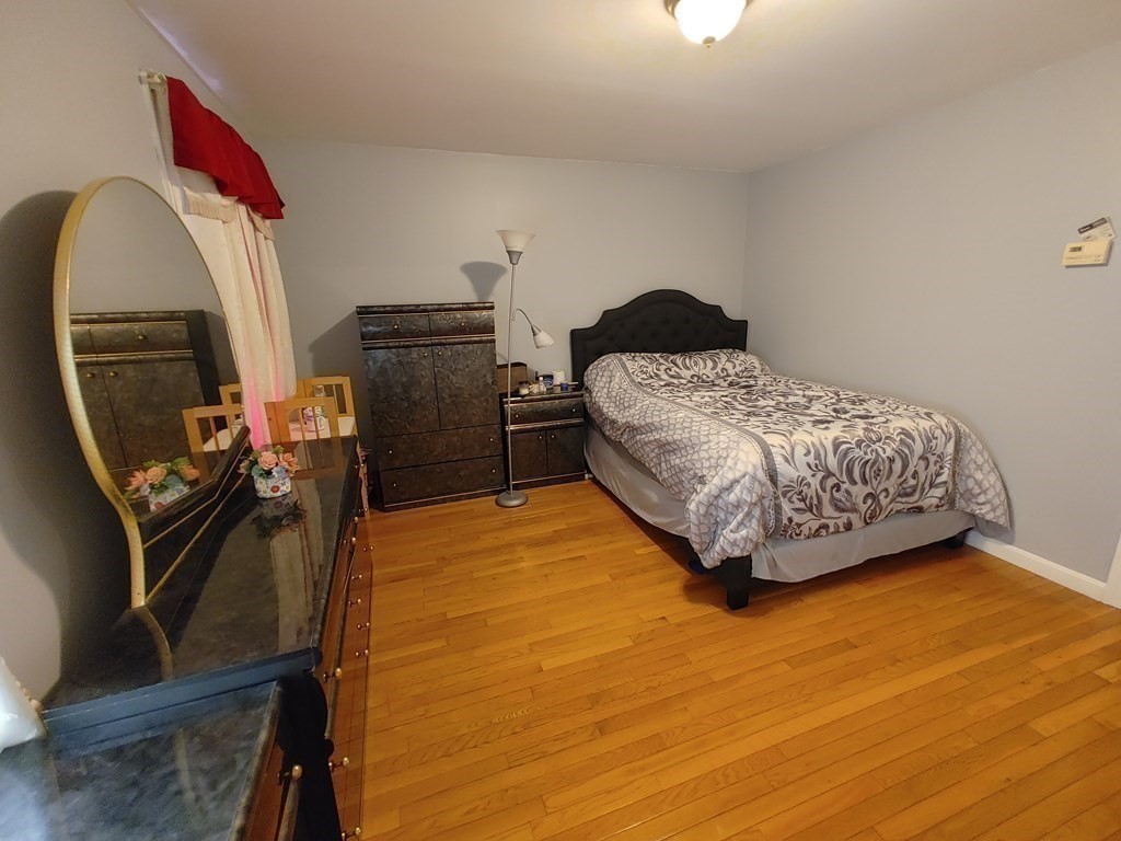 389 4th Street Fall River, MA 02721 - Photo 19 of 30 a bedroom with a bed and dresser