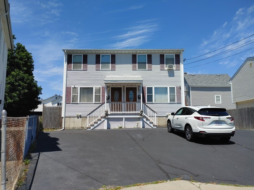 389 4th Street Fall River, MA 02721 - Photo 2 of 30 a car parked in front of a house