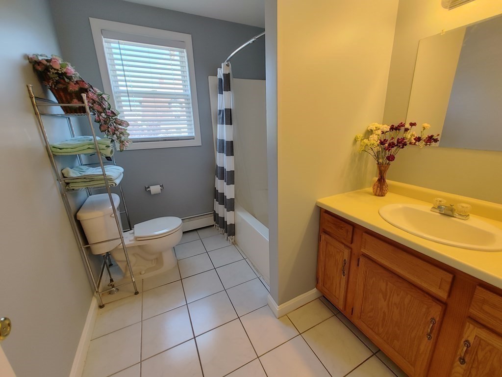 389 4th Street Fall River, MA 02721 - Photo 22 of 30 a bathroom with a sink and a mirror