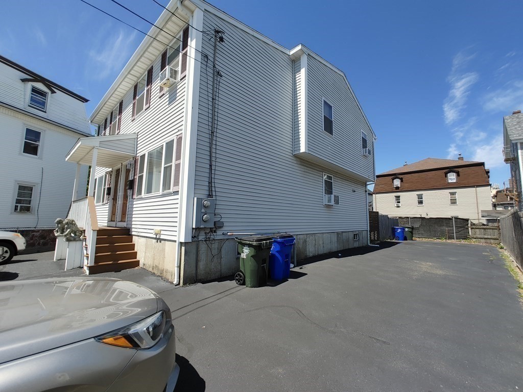 389 4th Street Fall River, MA 02721 - Photo 24 of 30 a front view of a house with a garage