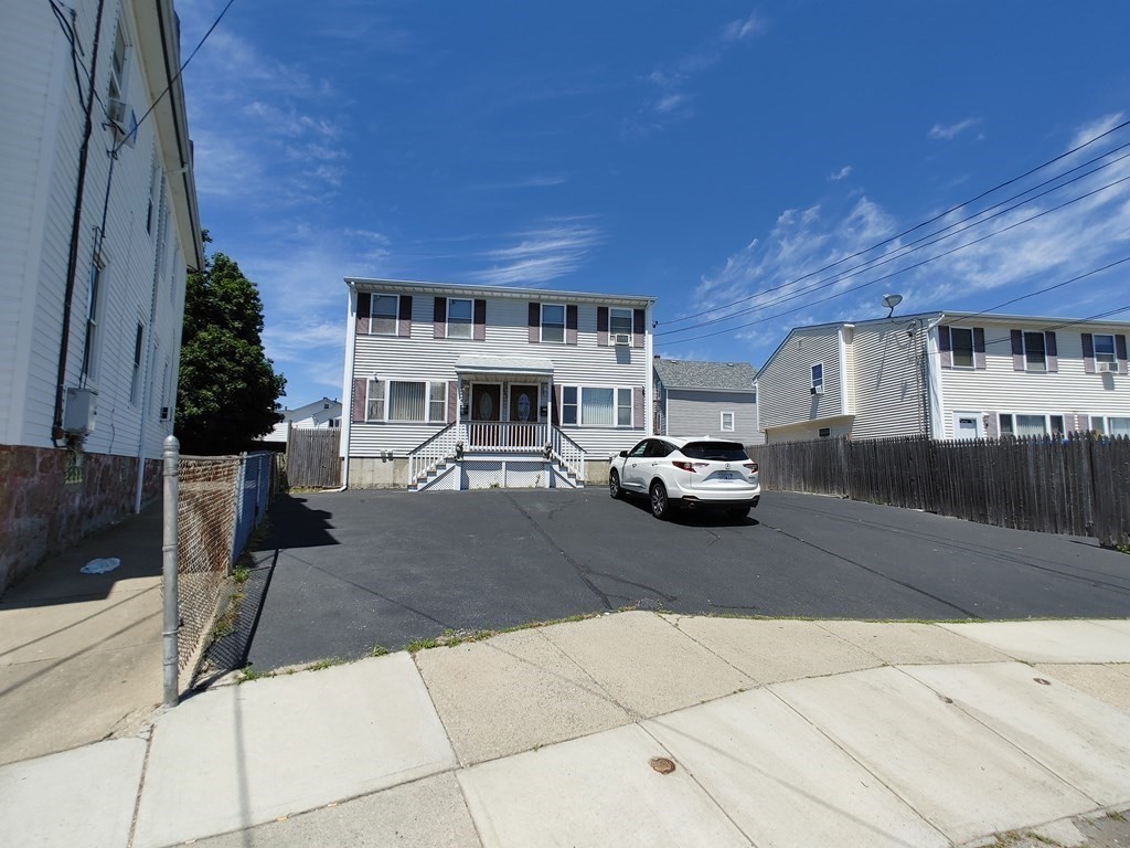 389 4th Street Fall River, MA 02721 - Photo 3 of 30 a car parked in front of building