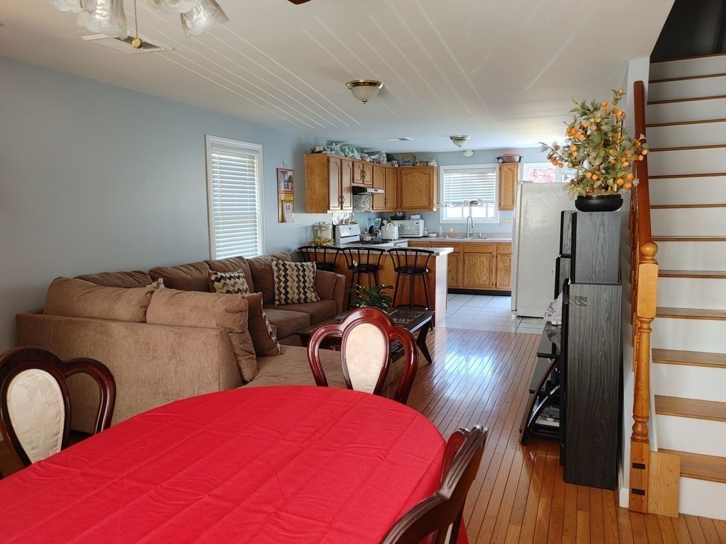 389 4th Street Fall River, MA 02721 - Photo 9 of 30 a living room with furniture kitchen view and a potted plant