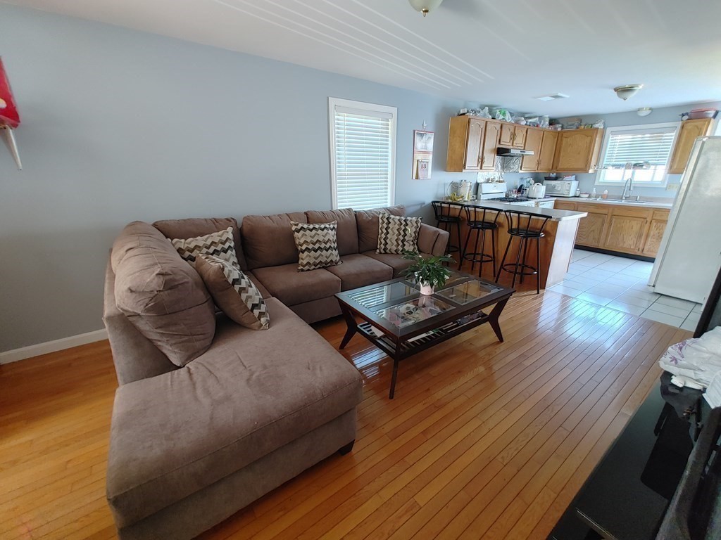 389 4th Street Fall River, MA 02721 - Photo 10 of 30 a living room with furniture and a wooden floor