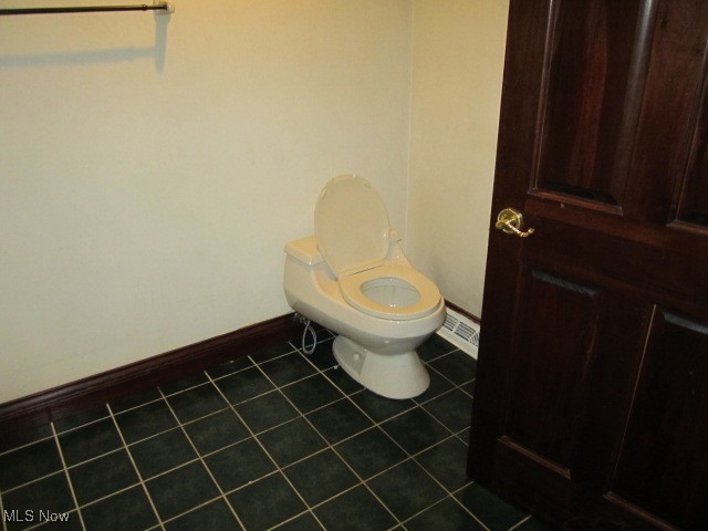 6999 Gates Road Gates Mills, OH 44040 - Photo 5 of 20 Bathroom featuring baseboards and dark tile patterned floors