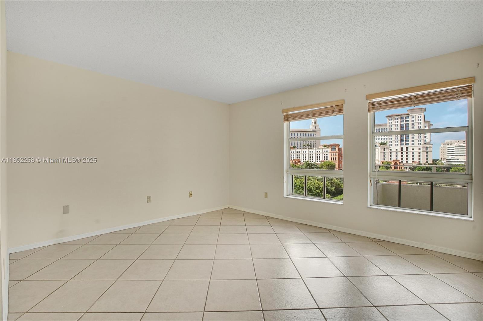 2351 Douglas Road, Unit 604 Miami, FL 33145 - Photo 12 of 26 a view of an empty room with a window