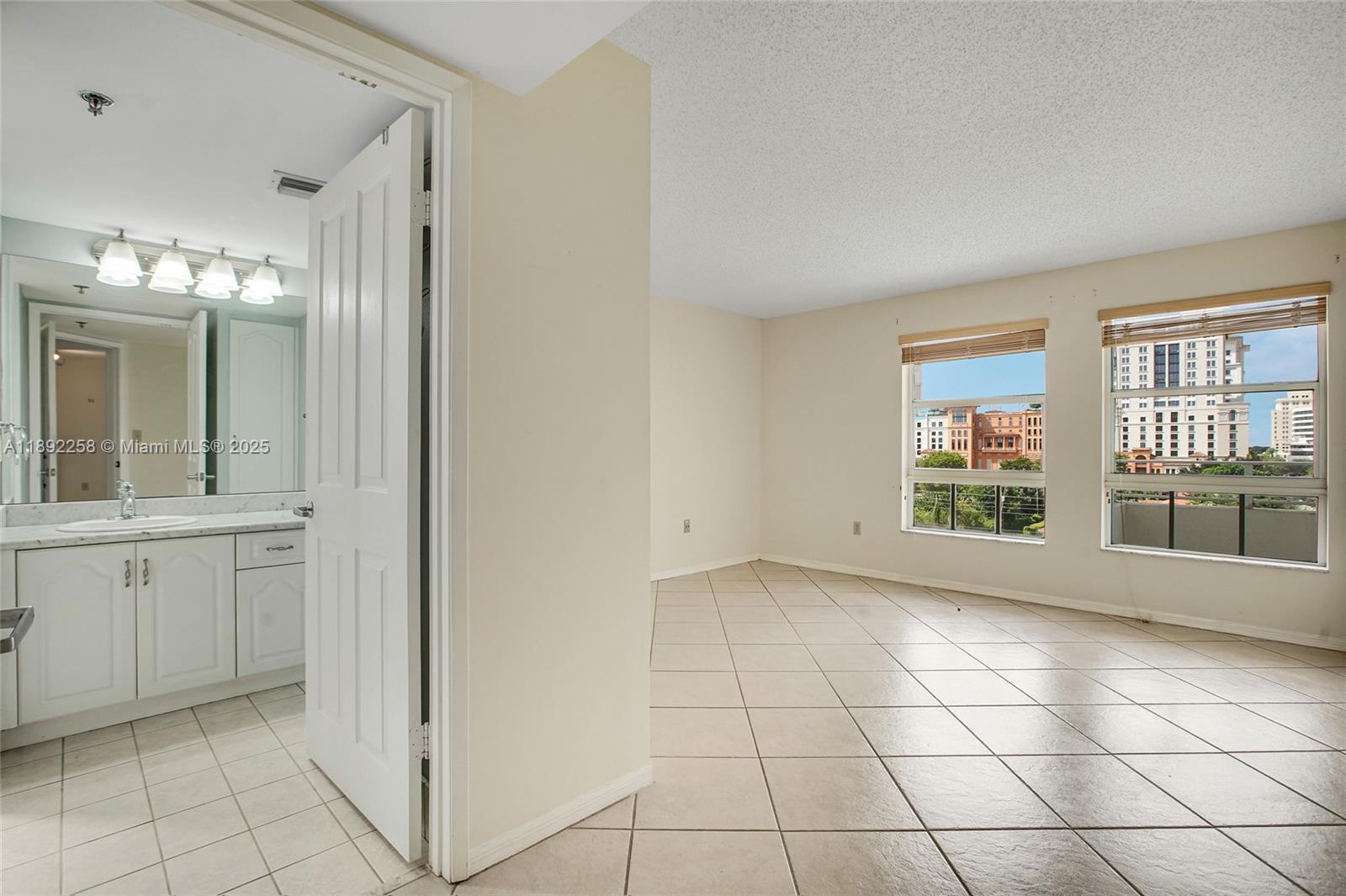 2351 Douglas Road, Unit 604 Miami, FL 33145 - Photo 13 of 26 a view of an empty room with window and bathroom