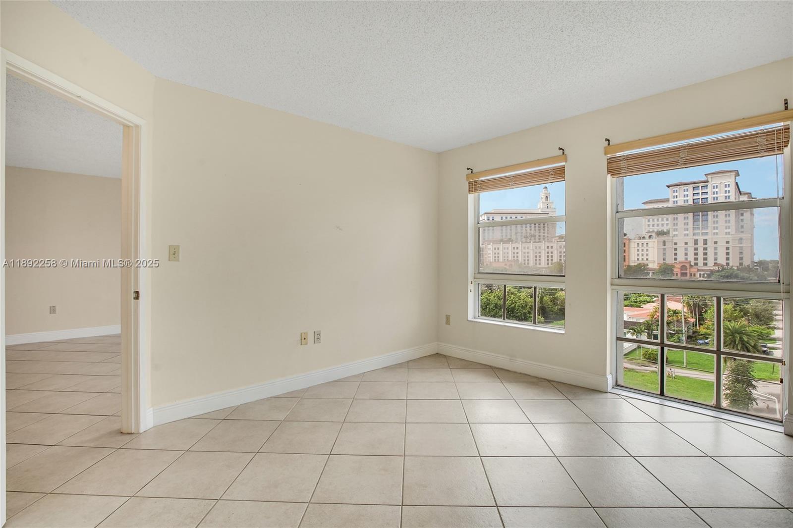 2351 Douglas Road, Unit 604 Miami, FL 33145 - Photo 19 of 26 a view of an empty room with a window