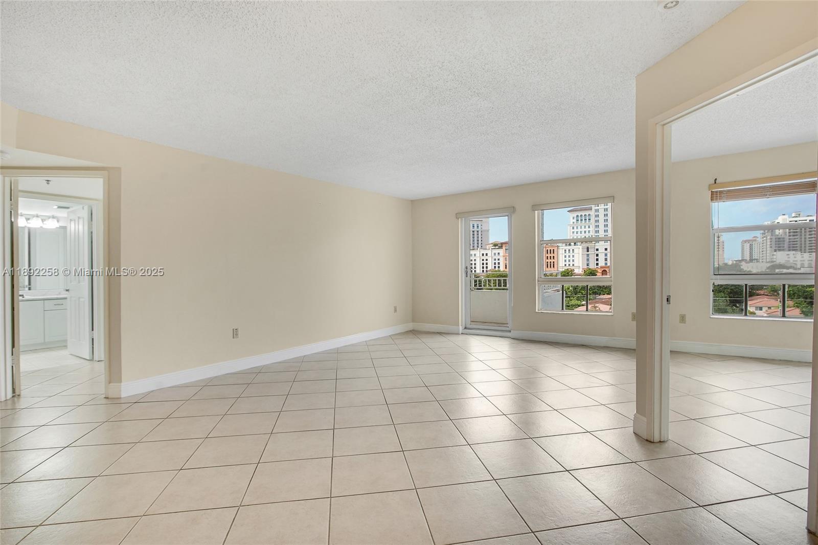 2351 Douglas Road, Unit 604 Miami, FL 33145 - Photo 3 of 26 a view of an empty room and window