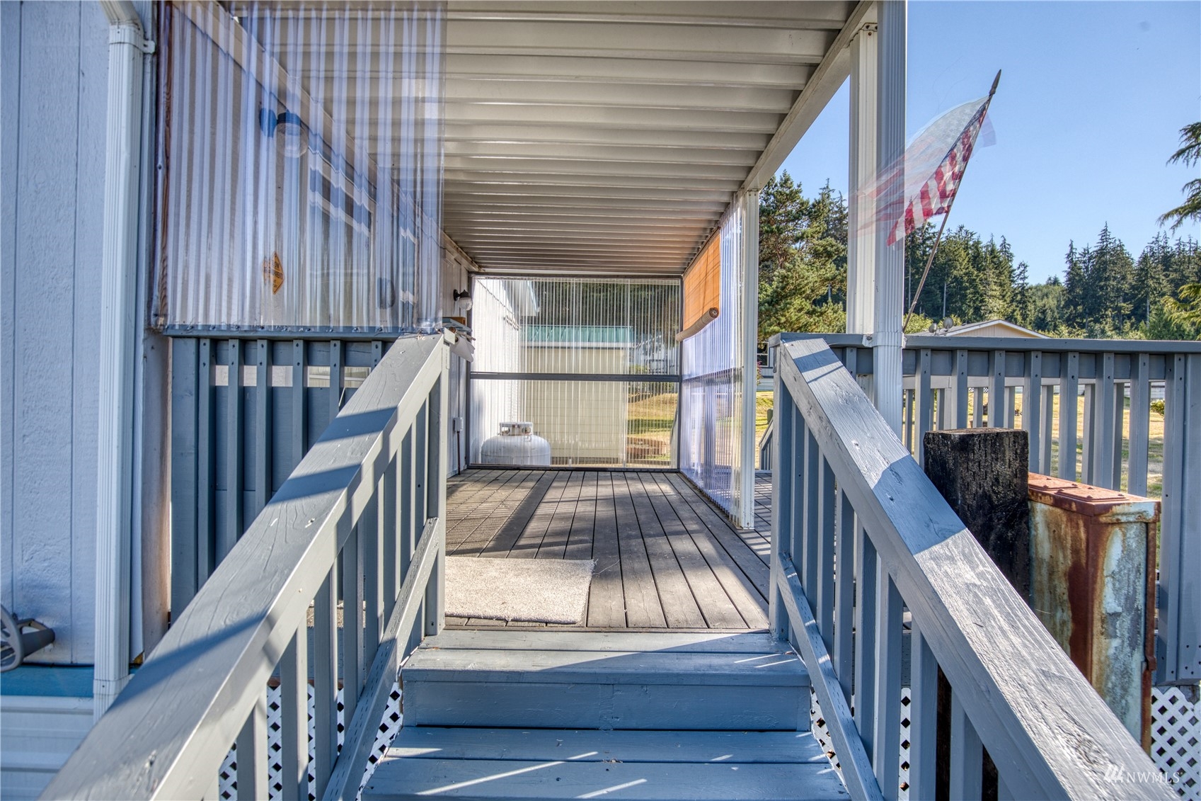 1019 Stanford Drive, Unit 26 Cosmopolis, WA 98537 - Photo 20 of 20 a view of balcony with wooden floor and fence