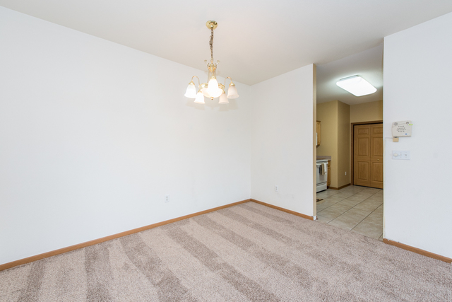 6739 Meadowlands Circle, Unit 6A Pleasant Prairie, WI 53158 - Photo 11 of 19 a view of a chandelier in big room and chandelier
