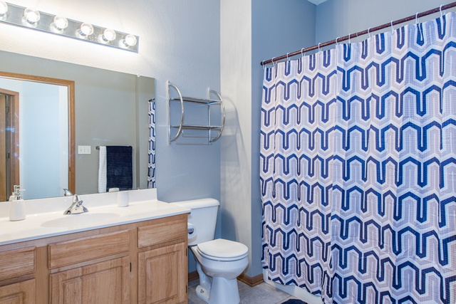 6739 Meadowlands Circle, Unit 6A Pleasant Prairie, WI 53158 - Photo 13 of 19 a bathroom with a sink and a toilet